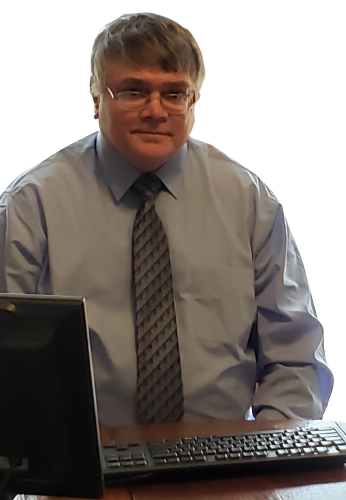 Tim Blank sitting in front of a computer screen